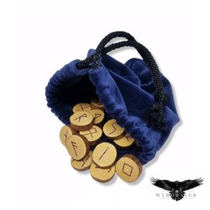 Elder Futhark Mock Orange Runes tumbling out of a blue velvet pouch- Viking Runes - Wyrdraven Runes - wyrdraven.co.uk