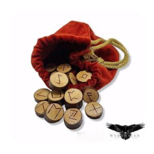 Elder Futhark Whitebeam Runes tumbling out of a red velvet pouch - Viking Runes - Wyrdraven Runes - wyrdraven.co.uk