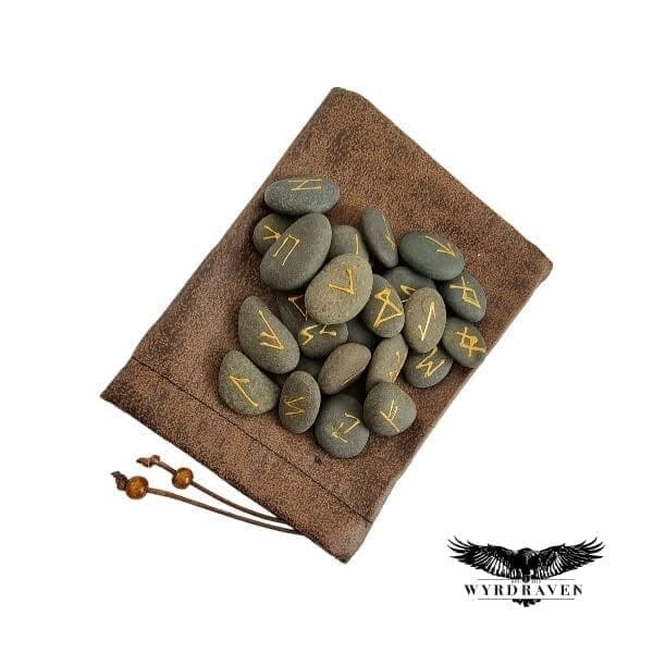 Elder Futhark River Stone Runes tumbling out of a brown, faux leather pouch - Viking Runes - Wyrdraven Runes - wyrdraven.co.uk